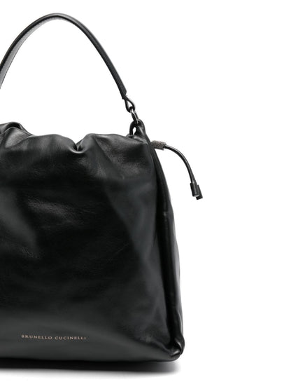 Soft leather bucket bag with precious details