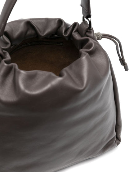 Soft leather bucket bag with precious details