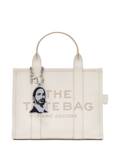 The marc face charm